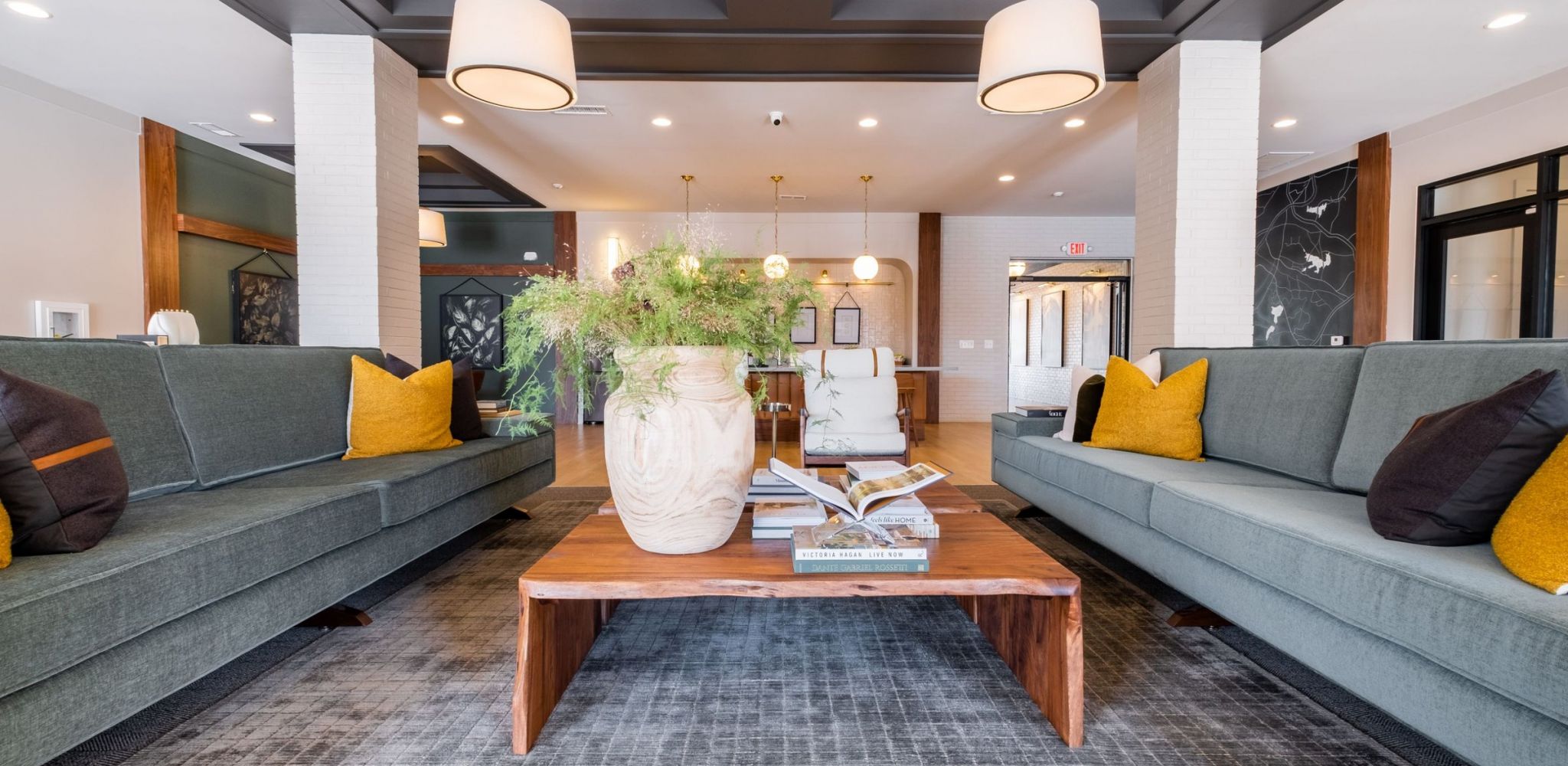 Hawthorne at Holly Springs resident clubhouse lounge area with 2 long couches and a coffee table